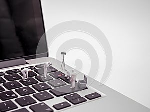 Team Of Miniature Forensics Experts Examining Laptop Keyboard 