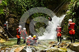 Team Of Mixed People On Canyoning Adventure