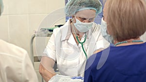 Team of nurses at work in operating room