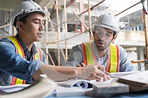 Team onsite of architecture inspector and discuss together photo