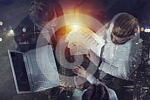 Team of people work together in office. Concept of teamwork and partnership. Double exposure.
