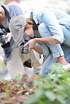 Team of photographers taking photos of flowers