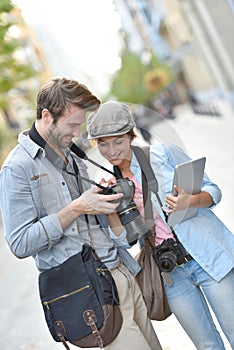 Team of photographers in town working