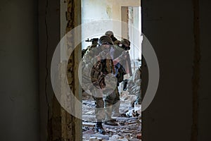 A team of professional airsoft players clear the location from opponents.