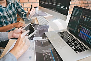 Team of Professional Developer programmer cooperation meeting and brainstorming and programming in website working a software and