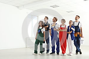 Team of professional painters with tools working