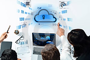 Team of Professionals Analyzing Data and Discussing Cloud Computing Security with Graphs and Charts in Modern Office