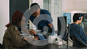 Team of programmers analyzing coding algorithms on laptop and computer