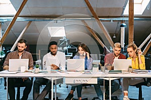 Team of programmers working in software developing company