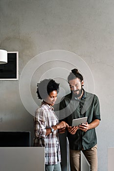 Team of programmers writing digital code in the metaverse and working together on the internet