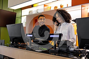 Team of receptionists working at the hotel reception desk
