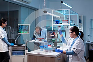 Team of scientific researchers working in modern laboratory