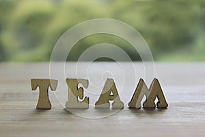 Team sentence written with wooden letters