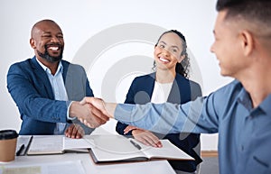 Team of smiling diverse business people shaking hands in office after meeting in boardroom. Group of happy professionals