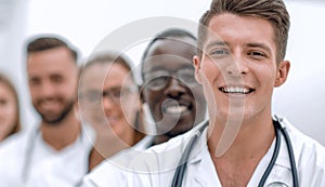 Team of smiling professional doctors standing together