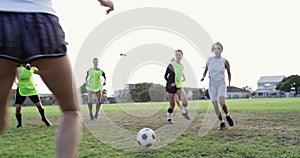 Team, soccer and women score goal at field, exercise or workout in competition. Group, kick and girls play football on