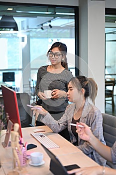 Team of software developers working together for developing website design and coding technologies at company