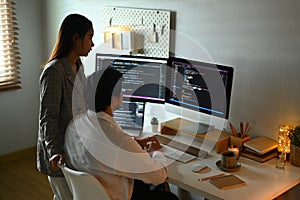 Team of software developers working together for developing website design and coding technologies