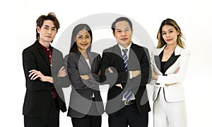 Team of successful business people in suit standing together with arms crossed. Portrait on white background with studio light