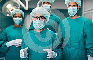 Team of surgeons in the operating room preparing for surgery