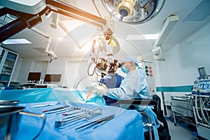 A team of surgeons performing brain surgery to remove a tumor.