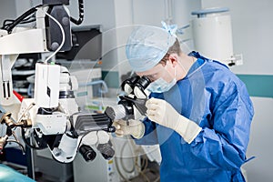 A team of surgeons performing brain surgery to remove a tumor. photo