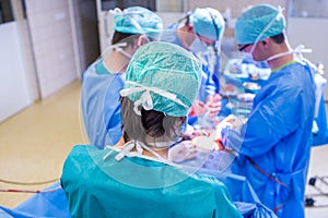 Team of surgeons performing an operation