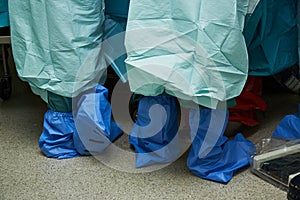 Team of surgeons performing surgery in operating room