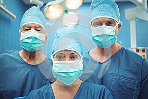 Team of surgeons wearing surgical mask in operation theater