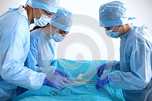 A team of surgeons at work in the operating room