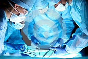 A team of surgeons at work in the operating room