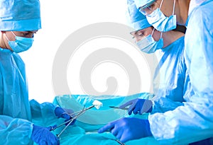 A team of surgeons at work in the operating room