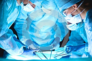 A team of surgeons at work in the operating room