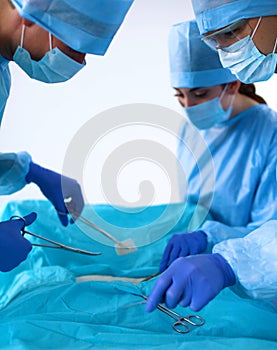 A team of surgeons at work in the operating room