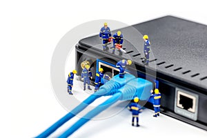 Team of technicians connecting network cable