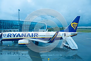 A team of technicians prepares the plane for departure
