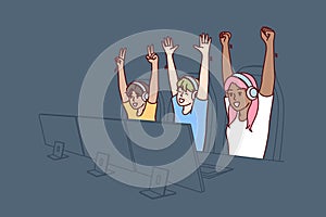 Team of teenagers esports or gamers have won multiplayer video game and are raising hands in triumph