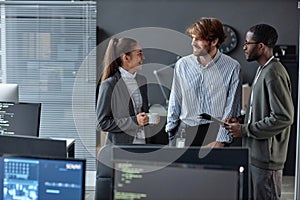 Team Of Three Young People Standing in Formal Office