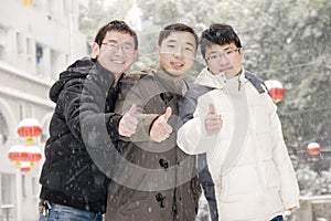 Team thumbs up in snow