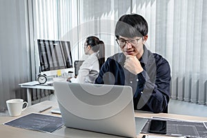 Team of two professional programmers working on website projects in software development on the desktop computer and making coding