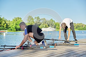 Team of two teenage boys kayaking on river