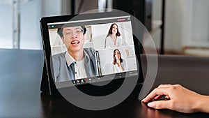 Team video call man sharing ideas women tablet