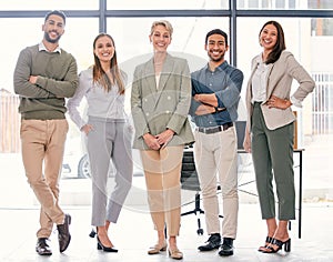 This team will carry you to success. Full length shot of a diverse group of businesspeople standing together in the