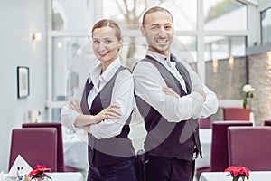 Team of woman and man waiter in a restaurant