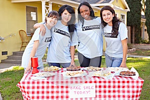 Team Of Women Running Charity Bake Sale