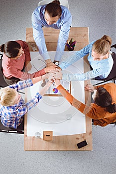 Team work concept. Business people joining hands