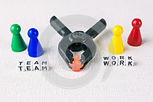 Team work concept - Figures form with clamp tool as symbol for a working labor team collaboration