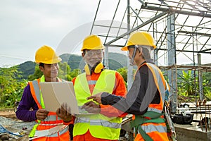 Team work construction engineer technician and worker control in the construction of roof structures on construction site