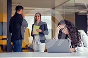 Team work discussing. Young woman with paper folder.