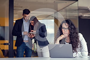 Team work discussing. Young woman with paper folder.